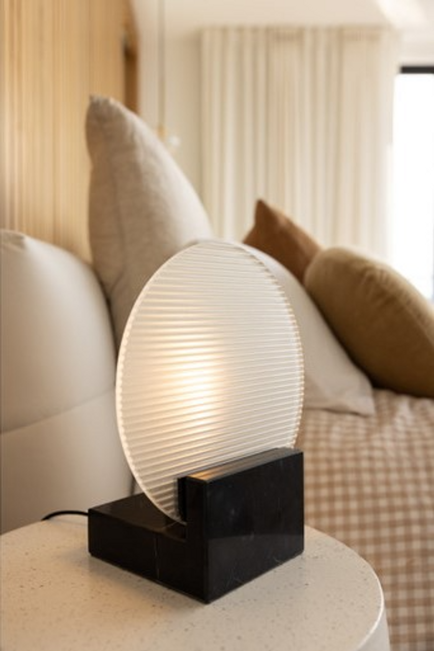 Black marble table lamp with clear glass