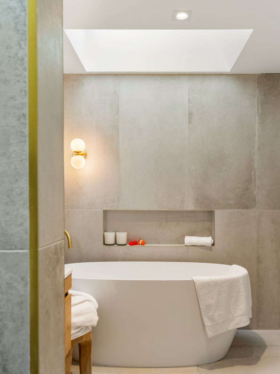 Brass wall light with two opal glass