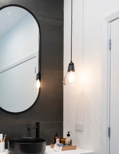 Black metal pendant paired with clear glass