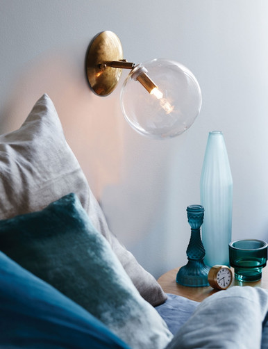 Brushed brass wall light with clear glass