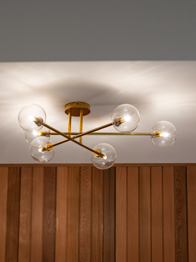 Brass six-light CTC fitting paired with clear glass