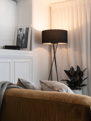 Black tripod floor lamp with black shade