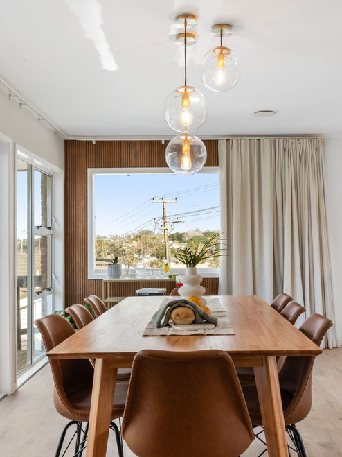 Clear glass paired with brass metalwork and black suspension