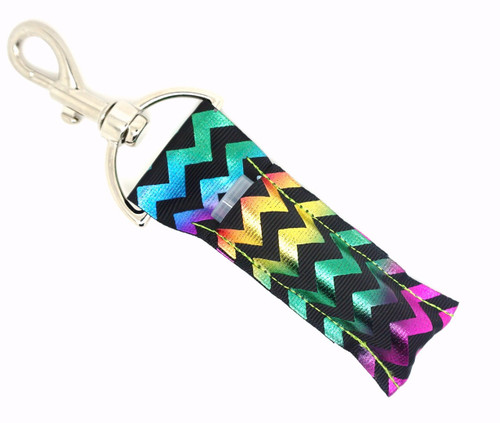 Shine Bright Rainbow Chevron Lip Balm Holder | Lippy Clip Keychain

Bring the sparkle and shine everywhere you go with Shine Bright—a bold and beautiful lip balm holder featuring a sleek black background with eye-catching rainbow foil chevron stripes. This dazzling design adds a modern pop of color and shimmer that stands out wherever you clip it.

Perfect for rainbow lovers, statement lovers, or anyone who can’t resist a little glam. Shine Bright keeps your lip balm handy and your style bold.

Why You’ll Love It:

Rainbow foil chevron on black background
Fits standard lip balms or chapsticks
Durable silver lobster clasp to attach anywhere
Handmade with high-quality printed fabric
Great gift for teens, trendsetters, and glitter fans

Product Details:

Design: Black background with shiny rainbow foil chevron

Material: High-quality printed fabric

Clip: Silver lobster clasp

Fits: Standard lip balm tubes (not included)

Includes: 1 Shine Bright lip balm holder

Handmade by Gettin Lippy in the USA