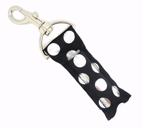 Lip Balm Holder Black with Silver Polka Dots 

Black with Silver Polka Dot lip balm holder! This beautiful Lip Balm or Chapstick Holder is HANDMADE with a high-quality materials! Our unique design and clasp offer both style and functionality. The hook is on a swivel head so the lip balm always falls back down and never gets stuck upside down, this is where most lip balm holders lose your lip balm or chapstick! This lip balm holder is designed to snuggly fit any standard lip balm or chapstick. Make sure your lip balm or chapstick will not get lost and grab one of these! 

BENEFITS: Misplacing or Losing your chapstick is the worst!! Don’t let that happen again and buy the perfect solution! Our Lip Balm / Chapstick Holder Keychain will make sure you always have your Gettin Lippy lip balm at hand when desperately needed. Our cute fun designs will compliment anything. Attach it to your keys, lanyard, back-pack, bag, purse, or anywhere your little heart desires with our easy open clasp!

PERFECT GIFTS: A simple gift can go a long way. Everyone needs something cute and functional. Buy now for stocking stuffers, birthday party, a team gift or for a daughter, friend, wife, girlfriend, colleague, student, teacher, etc!

BUY WITH CONFIDENCE: Read the reviews! Our Gettin Lippy Lip balm holders are the number one rated lip balm holders on the market! If you don’t LOVE our product, we offer 100% Money Back GUARANTEE no questions asked.

PACKAGE INCLUDES:  1 Unique Lip Balm / Chapstick holder. Each Holder is 6.5 inches (with hook) x 1.5 inches. **NOTE: Gettin Lippy lip balms in pictures are not included but click on the link below and get the best multi-flavored lip balm on the market: https://gettinlippy.com/gettin-lippyoriginal-line/ 

HANDMADE IN THE USA!!