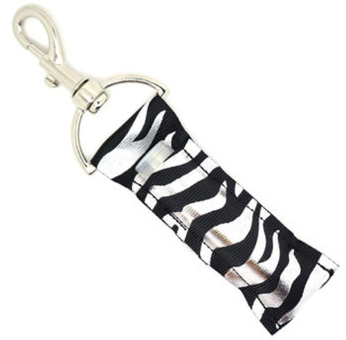 Lip Balm Holder Black and Silver Zebra 

Black and Silver Zebra lip balm holder! This beautiful Lip Balm or Chapstick Holder is HANDMADE with a high-quality materials! Our unique design and clasp offer both style and functionality. The hook is on a swivel head so the lip balm always falls back down and never gets stuck upside down, this is where most lip balm holders lose your lip balm or chapstick! This lip balm holder is designed to snuggly fit any standard lip balm or chapstick. Make sure your lip balm or chapstick will not get lost and grab one of these!  

BENEFITS: Misplacing or Losing your chapstick is the worst!! Don’t let that happen again and buy the perfect solution! Our Lip Balm / Chapstick Holder Keychain will make sure you always have your Gettin Lippy lip balm at hand when desperately needed. Our cute fun designs will compliment anything. Attach it to your keys, lanyard, back-pack, bag, purse, or anywhere your little heart desires with our easy open clasp! 

PERFECT GIFTS: A simple gift can go a long way. Everyone needs something cute and functional. Buy now for stocking stuffers, birthday party, a team gift or for a daughter, friend, wife, girlfriend, colleague, student, teacher, etc! 

BUY WITH CONFIDENCE: Read the reviews! Our Gettin Lippy Lip balm holders are the number one rated lip balm holders on the market! If you don’t LOVE our product, we offer 100% Money Back GUARANTEE no questions asked. 

PACKAGE INCLUDES:  1 Unique Lip Balm / Chapstick holder. Each Holder is 6.5 inches (with hook) x 1.5 inches. **NOTE: Gettin Lippy lip balms in pictures are not included but click on the link below and get the best multi-flavored lip balm on the market: https://gettinlippy.com/gettin-lippyoriginal-line/  

HANDMADE IN THE USA!!