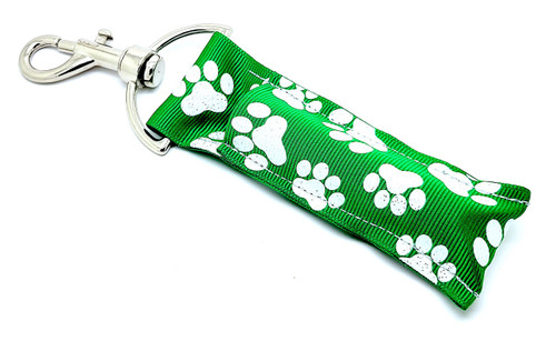 Lip Balm Holder Green with White Glitter Paw Prints 

Green with White Glitter Paw Prints lip balm holder! This beautiful Lip Balm or Chapstick Holder is HANDMADE with a high-quality materials! Our unique design and clasp offer both style and functionality. The hook is on a swivel head so the lip balm always falls back down and never gets stuck upside down, this is where most lip balm holders lose your lip balm or chapstick! This lip balm holder is designed to snuggly fit any standard lip balm or chapstick. Make sure your lip balm or chapstick will not get lost and grab one of these! 

BENEFITS: Misplacing or Losing your chapstick is the worst!! Don’t let that happen again and buy the perfect solution! Our Lip Balm / Chapstick Holder Keychain will make sure you always have your Gettin Lippy lip balm at hand when desperately needed. Our cute fun designs will compliment anything. Attach it to your keys, lanyard, back-pack, bag, purse, or anywhere your little heart desires with our easy open clasp!

PERFECT GIFTS: A simple gift can go a long way. Everyone needs something cute and functional. Buy now for stocking stuffers, birthday party, a team gift or for a daughter, friend, wife, girlfriend, colleague, student, teacher, etc! Also make sure you checkout our custom lip balms!

BUY WITH CONFIDENCE: Read the reviews! Our Gettin Lippy Lip balm holders are the number one rated lip balm holders on the market! If you don’t LOVE our products, we offer 100% Money Back GUARANTEE no questions asked.

PACKAGE INCLUDES:  1 Unique Lip Balm / Chapstick holder. Each Holder is 6.5 inches (with hook) x 1.5 inches. **NOTE: Gettin Lippy lip balms in pictures are not included but click on the link below and get the best multi-flavored lip balm on the market:  https://gettinlippy.com/gettin-lippyoriginal-line/ 

HANDMADE IN THE USA!!