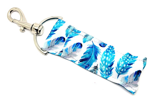Lip Balm Holder Blue Feathers

Blue Feathers lip balm holder! This beautiful Lip Balm or Chapstick Holder is HANDMADE with a high-quality materials! Our unique design and clasp offer both style and functionality. The hook is on a swivel head so the lip balm always falls back down and never gets stuck upside down, this is where most lip balm holders lose your lip balm or chapstick! This lip balm holder is designed to snuggly fit any standard lip balm or chapstick. Make sure your lip balm or chapstick will not get lost and grab one of these! 

BENEFITS: Misplacing or Losing your chapstick is the worst!! Don’t let that happen again and buy the perfect solution! Our Lip Balm / Chapstick Holder Keychain will make sure you always have your Gettin Lippy lip balm at hand when desperately needed. Our cute fun designs will compliment anything. Attach it to your keys, lanyard, back-pack, bag, purse, or anywhere your little heart desires with our easy open clasp!

PERFECT GIFTS: A simple gift can go a long way. Everyone needs something cute and functional. Buy now for stocking stuffers, birthday party, a team gift or for a daughter, friend, wife, girlfriend, colleague, student, teacher, etc!

BUY WITH CONFIDENCE: Read the reviews! Our Gettin Lippy Lip balm holders are the number one rated lip balm holders on the market! If you don’t LOVE our product, we offer 100% Money Back GUARANTEE no questions asked.

PACKAGE INCLUDES:  1 Unique Lip Balm / Chapstick holder. Each Holder is 6.5 inches (with hook) x 1.5 inches. **NOTE: Gettin Lippy lip balms in pictures are not included but click on the link below and get the best multi-flavored lip balm on the market: https://gettinlippy.com/gettin-lippyoriginal-line/  
 
MADE IN THE USA!!