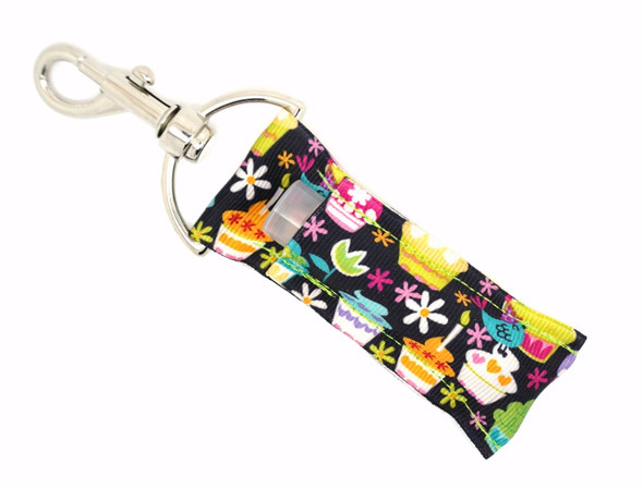 Cupcake Crush Lip Balm Holder ~ Cute Cupcake Lippy Clip Keychain

Sweeten your everyday routine with Cupcake Crush—an irresistibly cute lip balm holder featuring colorful cartoon cupcakes, whimsical hearts, swirls, and dainty tulips and daisies on a bold black background. It’s fun, flirty, and functional—perfect for anyone with a sweet tooth for style.

Whether you're gifting your bestie or treating yourself, this holder is a charming way to carry your favorite lip balm in sugary-sweet fashion.

Why You’ll Love It:


Cute cupcakes, hearts, dots, swirls, tulips & daisies

Fits standard lip balms, chapsticks, and more

Silver lobster clasp easily clips to keys, backpacks, or purses

Handmade using high-quality printed fabric

Adorable gift for bakers, cupcake lovers & teens

Product Details:


Design: Black background with colorful cupcakes, hearts, florals, and swirls

Material: High-quality printed fabric

Clip: Silver lobster clasp

Fits: Standard lip balm tubes (not included)

Includes: 1 Cupcake Crush lip balm holder

Handmade by Gettin Lippy in the USA