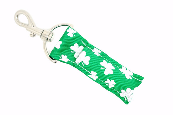 Lucky Charm Glow Lippy Clip - Green & Glitter Shamrock Lip Balm Holder

Add a dash of sparkle and a whole lot of charm with our Lucky Charm Glow lip balm holder! This festive design features a vibrant green background adorned with medium and small white glitter shamrocks, making it perfect for St. Patrick’s Day or anyone who loves a little Irish magic year-round.

Keep your lip balm handy in sparkling style while spreading good vibes and luck wherever you go!

Why You’ll Love It:
Glittery white shamrocks on vibrant green for that magical pop
Clips to your keys, purse, backpack, or lanyard
Keeps lip balm clean, secure, and easy to access
Perfect for holiday gifts, party favors, or treating yourself
Made with high-quality printed fabric for style and durability
Product Details:

Design: Green background with medium & small glittery white shamrocks

Material: Durable, high-quality printed fabric

Clip: Sturdy silver lobster clasp

Size: Fits standard lip balm tubes

Includes: 1 Lucky Charm Glow lip balm holder (lip balm not included)

Handmade by Gettin Lippy in the USA