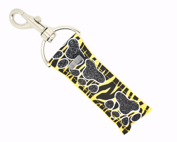 Wild Streak – Yellow and Black Zebra with Black Glitter Paw Lippy Clip

Bring the wild energy wherever you go with Wild Streak – a bold and playful lip balm holder from Gettin Lippy! This eye-catching design features a yellow and black zebra-striped background with large glittery black paw prints marching proudly down the middle. It’s the perfect combo of spirit, sparkle, and sass.

Perfect for animal print fans, sports moms, school spirit wear, or anyone who wants to add a fierce touch to their keys or bag. Stay lippy, stay stylish!

Why You’ll Love It:

Bold yellow & black zebra print
Sparkling glitter black paw prints
Clips easily to keys, backpacks, purses, or lanyards
Fits standard size lip balms (ChapStick®, Burt’s Bees®, etc.)
Great gift for animal lovers, team moms, or your wild side

Product Details:

Design: Yellow and black zebra stripes with glitter black paw prints

Material: High-quality printed fabric

Clip: Durable silver lobster clasp

Size: Holds most standard lip balm tubes or essential oil rollers

Includes: 1 Wild Streak lip balm holder (lip balm not included)

Handmade with care by Gettin Lippy in the USA