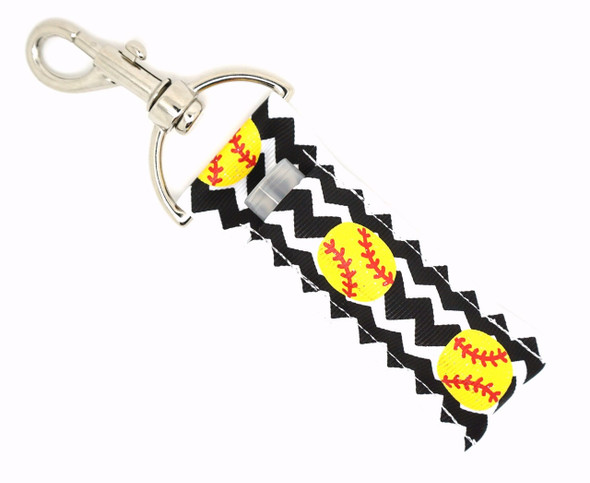 Strike Zone Sparkle – Softball Glitter Lippy Clip Keychain with Chevron Print

Slide into style with the Strike Zone Sparkle, a bold and sporty lip balm holder that knocks it out of the park! Featuring a sleek vertical black and white chevron background and a line of bright glittery softballs running down the middle, this lippy clip is the perfect accessory for players, fans, and softball moms alike.

Whether you're heading to practice, the ballpark, or just love sporty glam, this chapstick holder brings the heat while keeping your balm close and secure.

Why You’ll Love It:

Glitter Softballs – Eye-catching yellow glitter softballs add serious sparkle
Bold Chevron Print – Black and white vertical stripes bring contrast and style
Clip & Go – Attaches easily to keys, backpacks, bags, lanyards & more
Lip Balm Ready – Designed to fit standard-sized chapsticks or essential oil rollers
Perfect Gift – For softball moms, athletes, or anyone who loves sporty glam

Product Details:

Design: White & black vertical chevron with glitter softballs down the center

Material: High-quality printed fabric

Clip: Durable lobster clasp keyring

Size: Fits most lip balm brands

Includes: 1 Strike Zone Sparkle lip balm holder (lip balm not included)

Handmade with care by Gettin Lippy in the USA