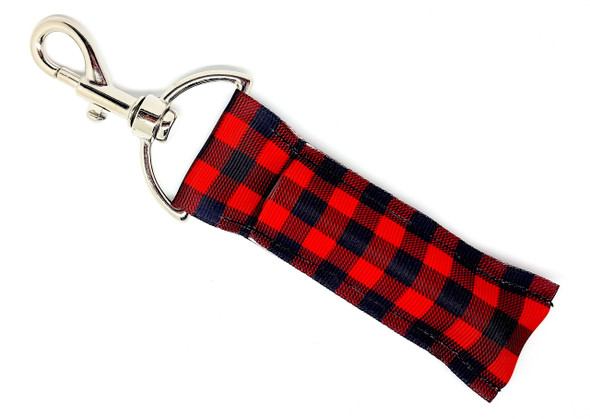 Plaid & Proud – Buffalo Plaid Lip Balm Holder Keychain

Rugged charm meets everyday convenience with the Plaid & Proud lip balm holder. Featuring a classic red and black buffalo plaid design, this cozy and stylish keychain gives flannel-season vibes all year long. Whether you’re sipping cocoa by the fire or braving the great outdoors, keep your favorite chapstick secure and close at hand.

Perfect for lovers of rustic style, camping, and timeless patterns!

Why You’ll Love It:

Rustic Vibes – Classic buffalo plaid never goes out of style
Always Within Reach – Clips easily to your keys, purse, or backpack
No More Lost Lip Balm – Stay chapstick-ready wherever you go
Lumberjack-Chic Gift – Perfect for stocking stuffers or plaid lovers

Product Details:

Size: Approx. 6.5" x 1.5"
Material: High-quality printed fabric
Includes: 1 Plaid & Proud lip balm holder (lip balm not included)

Handmade with love by Gettin Lippy in the USA