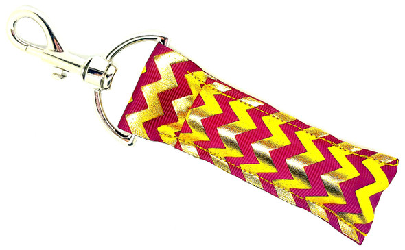 Chevron Chic Lippy – Burgundy & Gold Chevron Lip Balm Holder Keychain

Turn heads with the Chevron Chic Lippy—where luxe meets bold! This striking lip balm holder features a rich burgundy backdrop with raised gold chevron patterns cascading throughout, adding texture and sophistication to your everyday essentials. A perfect blend of glam and function, it’s a dazzling way to keep your lip balm stylishly close at hand.

Why You’ll Love It:
Elegant & Eye-Catching – Features raised gold chevron on deep burgundy
Textured Luxe Look – Adds a glam touch to your everyday accessories
Fashionably Functional – Keeps your chapstick handy and never lost
Perfect Gift – For glam girls, trendsetters, or classy accessory lovers
Product Details:
Size: Approx. 6.5" x 1.5"
Material: High-quality printed fabric
Includes: 1 Chevron Chic Lippy lip balm holder (lip balm not included)


Handmade with love by Gettin Lippy in the USA