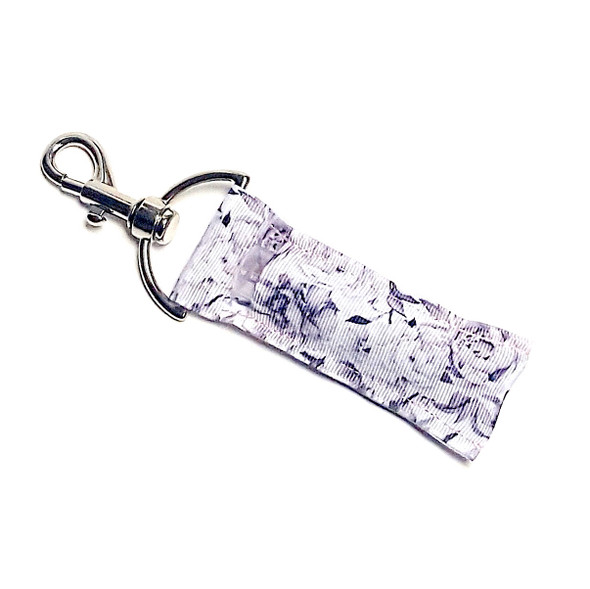 Petal Poise Lippy – Elegant Peony Lip Balm Holder Keychain

Embrace timeless beauty with the Petal Poise Lippy. This sophisticated lip balm holder showcases graceful white and gray peony blossoms, offering a soft, romantic vibe for flower lovers and minimalists alike. Whether you’re headed to brunch, work, or a night out, this floral accessory adds the perfect elegant touch to your everyday essentials.

Why You’ll Love It:
Romantic & Refined – Features beautifully sketched peonies in neutral white and gray
Chic Everyday Style – Subtle and stylish for any outfit or occasion
Practical & Pretty – Never dig through your bag for lip balm again
Perfect Gift Idea – Great for flower lovers, bridesmaids, or classy gift-givers
Product Details:
Size: Approx. 6.5" x 1.5"
Material: High-quality printed fabric
Includes: 1 Petal Poise Lippy lip balm holder (lip balm not included)


Handmade with love by Gettin Lippy in the USA