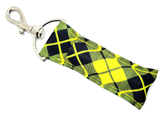Diamond Daze Lip Balm Holder – Bold Black & Yellow Diamond Design

Add a dose of daring to your daily essentials with our Diamond Daze Lip Balm Holder! Designed with a striking black and yellow diamond pattern, this fierce geometric accessory commands attention while keeping your lip balm exactly where you need it.

Whether you're channeling bold vibes, matching your team colors, or just obsessed with standout patterns, this keychain-ready holder is perfect for keeping your favorite balm within reach — and doing it in style.

Why You'll Love It:
 Geometric Glamour
Make a statement with this crisp black and yellow diamond print — modern, edgy, and eye-catching.

Easy Clip-On Convenience
Features a secure swivel clasp that attaches effortlessly to keyrings, purses, backpacks, or gym bags.

Crafted With Care
Each holder is handmade in the USA using premium fabric and high-quality hardware for a durable, lasting finish.

Gifting Made Easy
"Diamond Daze" makes a bold impression in:

Birthday bundles

Teacher appreciation gifts

Stocking stuffers

Sports team spirit packs

Back-to-school must-haves

Happiness Guaranteed
We stand by our products 100%! Love it or get your money back — no questions asked.

Product Details:

Size: 6.5 inches (including clasp) x 1.5 inches

Material: Premium woven fabric with sturdy metal clasp

Includes: 1 "Diamond Daze" Lip Balm Holder

Note: Lip balm not included

Handmade in the USA with care
