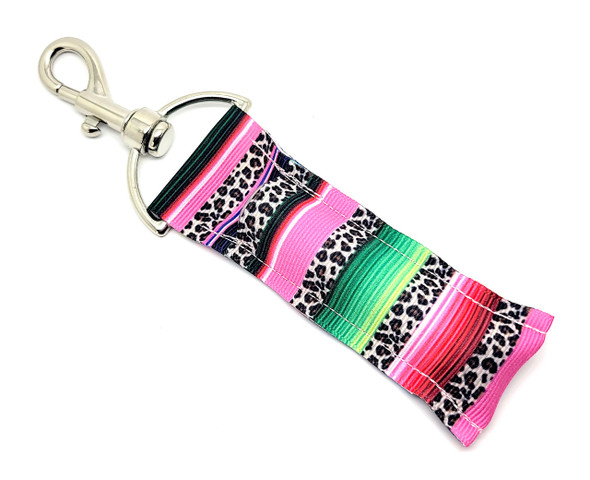 Leopard Rainbow Lip Balm Holder – Wild, Colorful, and Totally Unique!

Get ready to show off your bold side with our Leopard Rainbow Lip Balm Holder! This vibrant design features alternating stripes of classic leopard print and brightly colored sections of red, pink, green, yellow, blue, and purple. The colors are mixed in a stunning, non-traditional rainbow style that adds a wild, playful pop to your keys, purse, or backpack.

Perfect for anyone who loves a little fierce flair, this lip balm holder keeps your favorite balm handy while showing off your colorful personality!

Why You’ll Love It

Wild & Colorful Design
The perfect fusion of fierce leopard spots and vibrant rainbow hues! Bold, vivid, and beautifully placed stripes make this lip balm holder a standout accessory for any season.

Never Lose Your Lip Balm Again
Attach it to your keys, bag, or lanyard with the secure swivel clasp. No more digging for your balm—it’s always right where you need it.

Handmade Quality
Crafted with care in the USA, our lip balm holders are made to be both stylish and durable, standing up to daily use while keeping you fabulous.

Makes a Fun & Fierce Gift
Great for birthdays, holidays, back-to-school, or just because! Perfect for leopard lovers, color enthusiasts, and anyone who likes their accessories bold and beautiful.

Product Details

Dimensions: 6.5 inches (with hook) x 1.5 inches

Material: High-quality neoprene with keyring swivel clasp

Fits standard lip balm or chapstick tubes

Lip balm not included

Unleash Your Bold Style

Add the Leopard Rainbow Lip Balm Holder to your collection today—because your lip balm deserves a home as vibrant as you are!