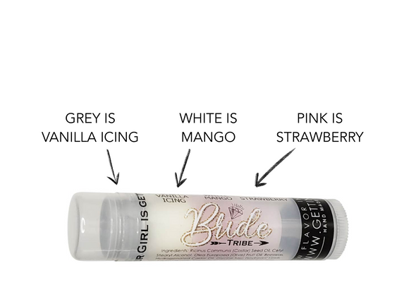 Bride Tribe Lip Balm – Kiss the Miss (Single Tube)
"One Balm to Unite the Bride Squad"

Product Description:
The Perfect Swipe for Every Bride Babe

Say “I do” to soft, kissable lips with the Bride Tribe Lip Balm – Kiss the Miss (Single Tube) by Gettin Lippy. Whether you're building the perfect bridesmaid proposal box, curating bridal shower favors, or treating yourself to some pre-wedding pampering, this triple-flavored balm is the glamorous must-have for every member of the bride squad.

Featuring our iconic three-layered design, each balm brings a full flavor journey—and all the hydration your lips need for toasts, selfies, and sweet goodnight kisses.

Flavor Journey – Triple-Layered Goodness:

Grey Layer – Vanilla Icing: Sweet and smooth like a wedding cake

White Layer – Mango: Light and refreshing

Pink Layer – Strawberry: Bright and fruity with a hint of sass

Don’t worry—it applies clear, leaving just the right amount of shine and zero sticky mess.

Product Highlights:

Triple-Layered Design – Three flavors in every tube

Applies Clear – No weird color, just delicious moisture

Nourishing & Natural – Made with Beeswax, Castor Seed Oil & Olive Fruit Oil

Cruelty-Free & Made in the USA

Lippy Clip Compatible – Easily attaches to your favorite lip balm holder


Why You'll Love It:

The perfect add-on gift for bridal boxes, favors, or welcome bags

Great for on-the-go touchups during wedding events

Makes lips feel soft, smooth, and party-ready

Stock up and save automatically—no code needed!

Hot Tip:

Great for parties, gift bags, or just treating all your bridesmaids to a little something sweet.

Safe, Simple, & Sassy

No Phthalates, Formaldehyde, or Alcohol

Eco-Conscious Packaging

Perfect for Sensitive Skin & Acne-Prone Pouts

12-Month Shelf Life

One Balm, Endless Bridesmaid Love

From the first party to the last dance, this single tube of Bride Tribe goodness is the lip balm that will carry your girls through every smile, toast, and group photo.

Treat yourself—or the whole crew—with Bride Tribe – Kiss the Miss.

MADE IN THE USA!!