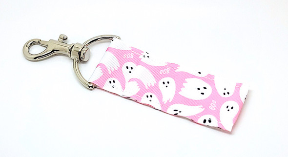 Soft Pink "Boo!" Halloween Ghost Lip Balm Holder

Add a little pretty to your spooky with our Soft Pink Halloween Ghost Lip Balm Holder! This charming design features white flying ghosts scattered across a soft pink background with the playful word “Boo!” floating through. It's the perfect mix of spooky and sweet—ideal for ghost lovers, pastel Halloween fans, and anyone who adores a cute twist on classic Halloween!

Whether you’re building a boo basket, surprising your best ghoul friend, or treating yourself, this lip balm holder is a must-have Halloween accessory!

Why You’ll Love It:
Keep Your Lip Balm Handy

Easily clip this soft pink holder onto your keys, backpack, purse, or lanyard with its secure swivel clasp. Never dig through your bag again for your favorite balm!

Sweetly Spooky Design

Celebrate spooky season in style with flying white ghosts and soft pink vibes! A perfect pastel-Halloween match for those who like their fright with a little flair.

Handmade in the USA

Each holder is lovingly crafted with durable, high-quality materials—built to last all season and beyond. Practical, stylish, and made with care.

Makes a Great Gift For:

Halloween Boo Baskets

Pink Halloween Aesthetic Lovers

Fall Party Favors

Friends, Teens, Teachers, & Coworkers

Pairing with our Gettin Lippy Halloween Lip Balm Packs!

Satisfaction Guaranteed

We proudly stand behind all Gettin Lippy products. If you don’t absolutely love your lip balm holder, we’ll refund your purchase—100% guaranteed.

Product Details:

Dimensions: 6.5 inches (with hook) x 1.5 inches

Includes: 1 Soft Pink "Boo!" Ghost Lip Balm Holder

Note: Lip balm not included—pair with one of our Halloween lip balm packs for a complete gift!

Handmade in the USA – Order yours before they vanish!