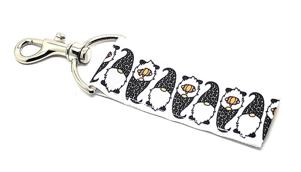 Leopard Hat Pumpkin Gnome Lip Balm Holder

Fall in love with the cutest way to keep your lip balm close! Our Leopard Hat Pumpkin Gnome Lip Balm Holder features an adorable white background with cozy little gnomes, each rocking a fierce leopard print hat and holding a tiny orange pumpkin. It’s the perfect blend of autumn charm and trendy style—ideal for fall lovers, gnome collectors, and fashion-forward folks alike.

Designed with convenience in mind, this holder easily clips onto your keys, purse, backpack, or diaper bag. Never lose track of your lip balm again, and do it in seasonal style!

Why You’ll Love It
Fall Fashion Meets Function

This isn’t just cute—it’s practical too! The leopard hat gnomes bring a trendy twist to fall fashion, while the pumpkin detail adds cozy autumn vibes.

Clip & Go Convenience

Equipped with a secure swivel clasp, you can attach this lip balm holder anywhere. Keep your lip balm within reach at all times—no digging, no losing, no mess.

Handmade Quality

Proudly handmade in the USA with durable materials and attention to detail. This isn’t your average chapstick holder—it’s a statement accessory!

Perfect For:

Fall gifts & Thanksgiving favors

Gnome lovers & collectors

Teachers, coworkers, friends & teens

Fall market & vendor events

Anyone obsessed with leopard print or autumn aesthetic

Buy With Confidence

At Gettin’ Lippy, our holders are top-rated and backed with a 100% Money-Back Guarantee. If you're not totally in love, we'll make it right—no hassle.

Product Details:

Dimensions: 6.5 inches (with hook) x 1.5 inches

Includes: 1 Leopard Hat Pumpkin Gnome Lip Balm Holder

Note: Lip balm not included. Pair it with our fall 3-layer lip balms for the perfect seasonal gift combo!

Handmade in the USA – Snag Yours Before They Disappear This Fall!