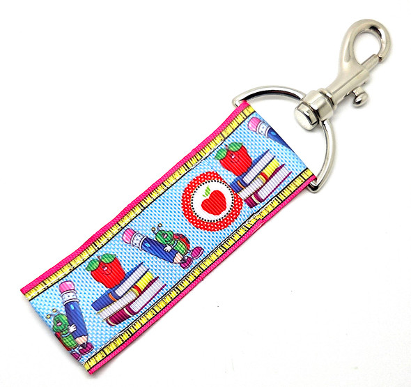 “Retro Rules” – Teachers Lip Balm Holder

Take a nostalgic trip down memory lane with our “Retro Rules” Lip Balm Holder! Designed with a blue and white dotted background framed by rulers along the sides, this adorable piece captures the charm of vintage classroom style.

In the center, you’ll find apples, a school bus, crayons, a backpack, and a cheerful little bug holding a pencil, and perched atop a stack of books a cute apple — it’s retro, whimsical, and totally teacher-approved.

Perfect for clipping to your keys, badge, or tote, this lip balm holder keeps your balm secure and easy to find while adding a dash of nostalgic flair to your day.

Why You’ll Love It

Retro-Inspired Design:
Charming school icons and a classic dotted pattern give this holder a playful old-school aesthetic teachers adore.

High-Quality Printed Fabric:
Soft, durable, and beautifully vibrant — made to last through many school years.

No More Lost Lip Balm:
The swivel clasp keeps your balm handy on any lanyard, keychain, or bag.

Perfect Teacher Gift:
Fun, functional, and full of character — ideal for teacher appreciation, back-to-school, or just because!

Handmade in the USA:
Lovingly crafted for teachers who make every classroom moment special.

Perfect For:

Teachers, aides, and retro-style lovers

Back-to-school or appreciation gifts

Teachers who love vintage charm with a modern twist

Coordinating with Gettin Lippy lip balms and wristlets

Anyone who believes retro still rules!

Product Details

Dimensions: 6.5 inches (with hook) x 1.5 inches

Includes: 1 Lip Balm Holder (lip balm not included)

Material: High-quality printed fabric

Handmade in the USA

Pair it with your favorite Gettin Lippy lip balm for the perfect classroom combo — because retro never goes out of style and neither should your lip care game!