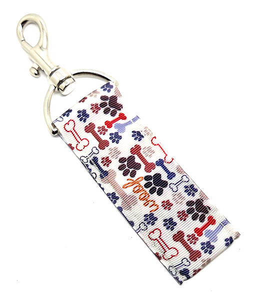 Woof & Ready – Dog Bones & Paw Print Lip Balm Holder Keychain

If your life motto is basically “dogs, snacks, repeat” — then the Woof & Ready Lip Balm Holder is about to become your new everyday essential.

Featuring a warm tan background covered in playful brown and blue dog bones, paw prints, and cheerful WOOF! doodles, this lip balm holder is the perfect way to show off your love for all things canine while keeping your lip balm exactly where you left it.

Clip it onto your keys, dog-walking bag, backpack, or purse and bring a little tail-wagging charm with you wherever you go!

Why You’ll Love It

Doggie Doodle Design – Cute bones, paws, and “WOOF” graphics that celebrate your furry best friend

Perfect for Dog Lovers – Great for dog moms, pet sitters, walkers, groomers, and anyone who’s obsessed with their pup

Chapstick Saver – No more digging through your bag — your lip balm stays handy and secure

Stylish + Practical – A fun accessory that’s as useful as it is adorable

Product Details

Size: Approx. 6.5" x 1.5"

Material: High-quality printed fabric

Includes: 1 Woof & Ready lip balm holder (lip balm not included)

Handcrafted in the USA