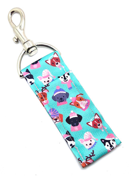 Cold Noses, Cozy Hats – Winter Pup Vibes Lip Balm Holder

Get ready to sleigh your winter style with the Cold Noses, Cozy Hats Lip Balm Holder — the perfect seasonal accessory for dog lovers and anyone who can’t resist a cute holiday vibe!

This festive design features a cheerful green background covered in adorable dogs with stocking hats in fun, playful patterns. Whether it reminds you of bundling up your pup for a frosty walk or just gives you that cozy winter feeling, this lip balm holder is guaranteed to keep your chapstick close, secure, and ready for every chilly day.

Clip it onto your keys, purse, backpack, lanyard, or dog-walking bag so you’re never left with dry lips — even on the coldest mornings.

Why You’ll Love It

Festive Winter Design – Green background with cute stocking hats for that cozy holiday vibe

Perfect for Dog Lovers & Winter Fans – Great for dog moms, pet parents, or anyone who loves the warm + fuzzy aesthetic

Never Lose Your Chapstick Again – Swivel clasp keeps your lip balm secure, upright, and easily accessible

Cute + Durable – High-quality fabric made for everyday use

Product Details

Size: Approx. 6.5" x 1.5"

Material: High-quality printed fabric

Includes: 1 Cold Noses, Cozy Hats lip balm holder (lip balm not included)

Handcrafted in the USA