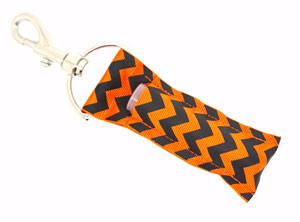 Spiced Stripes – Burnt Orange & Black Chevron Lip Balm Holder Keychain

Warm, bold, and stylish—Spiced Stripes is the perfect blend of cozy fall vibes and practical convenience. Featuring striking burnt orange and black chevron stripes, this lip balm holder brings seasonal spice to your everyday essentials.

Whether you're hitting the pumpkin patch or heading into the office, this handy keychain keeps your chapstick close and your look on point.

Why You’ll Love It:
Fall-Forward Style – Bold burnt orange and black chevron for a cozy, chic look
Easy Access – Never dig for lip balm again
High-Quality Feel – Made to last with soft yet sturdy printed fabric
Perfect Gift – Great for fall lovers, teachers, and students
Versatile Accessory – Clip it to your keys, purse, backpack, or lanyard
Product Details:

Size: Approx. 6.5" x 1.5"

Material: High-quality printed fabric

Includes: 1 Spiced Stripes lip balm holder (lip balm not included)

Handmade with love by Gettin Lippy in the USA