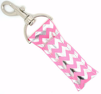 Pink Spark Vibes – Pink Chevron Lip Balm Holder Keychain with Silver Foil Accents

Add a spark of shimmer to your everyday essentials with Pink Spark Vibes, the lip balm holder that brings beauty and brilliance in one dazzling package. Featuring a radiant pink background and raised silver foil chevron pattern, this holder is both playful and polished—perfect for anyone who loves a little sparkle on the go.

Attach it to your keys, purse, or backpack for quick access to your favorite lip balm while showing off your stylish side. It’s glam, functional, and fabulous—just like you.

Why You’ll Love It:
Shiny & Chic – Bold pink with elegant silver foil chevron
Perfectly Glam – Adds sparkle to your daily routine
Portable & Pretty – Keep lip balm close, stylishly
Gift-Ready – Ideal for glam girls, teens, and trendsetters
Instagram-Worthy – Looks as good as it functions
Product Details:

Size: Approx. 6.5" x 1.5"

Material: High-quality printed fabric

Includes: 1 Pink Spark Vibes lip balm holder (lip balm not included)

Handmade with love by Gettin Lippy in the USA