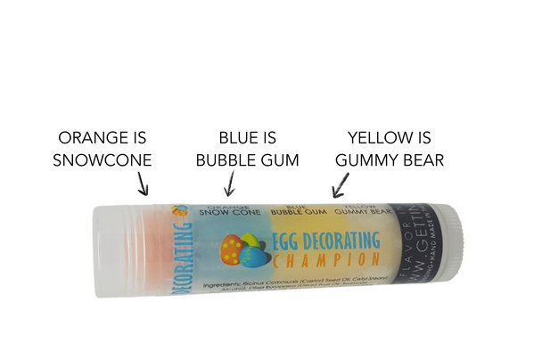 Egg Decorating Champion – Triple-Layer Easter Lip Balm

Product Description:
The Flavor Champion of Every Easter Basket! 

Ready to win at Easter gifting? Say hello to Egg Decorating Champion—a Gettin Lippy original, packed with three layered flavors, loads of moisture, and zero stickiness. Whether you’re stuffing baskets, treating yourself, or building the ultimate springtime keychain, this festive lip balm brings flavor, fun, and hydration to your Easter celebration.

This vibrant tube features:

Orange Layer: Cool, icy Snow Cone

Blue Layer: Classic, nostalgic Bubble Gum

Yellow Layer: Sweet and chewy Gummy Bear

Each layer offers a lip-smacking experience while applying completely clear—so it looks festive, but wears like your favorite everyday balm!

Why You’ll Love It:

Three Delicious Flavors in One Tube

Applies Clear – No tints, just flavor & hydration

Ultra-Moisturizing with Olive Fruit Oil, Castor Seed Oil & Beeswax

Non-Sticky, Silky-Smooth Finish

Great Bulk Discounts – Save on sets of 3, 6, or 12

Perfectly Fits Our Lip Balm Holders & Safety Keychain Wristlets

Made in the USA with Premium, Clean Ingredients

Easter Gift Favorite – Great for kids, teens, and grown-up lips too!

Whether you're prepping for a classroom handout, curating thoughtful gift bags, or upgrading your lip game, this balm delivers Easter fun one swipe at a time. 

MADE IN THE USA!!