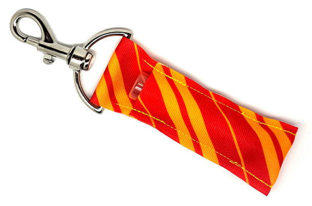 Twist & Lippy – Candy Stripe Lip Balm Holder Keychain

Bright, bold, and full of fun—meet the Twist & Lippy lip balm holder! With a sweet yellow background and angled red stripes in varying widths, this design brings classic candy cane vibes with a sunshine twist. Whether you're channeling carnival fun or adding a pop of color to your everyday routine, this cheerful accessory keeps your chapstick close and your style on point.

Perfect for teachers, teens, candy lovers, and anyone who loves playful accessories!

Why You’ll Love It:
Playfully Striped – A fun candy stripe design in warm, vibrant tones
Practical & Cute – Clips to bags, keys, or backpacks with ease
Never Lose Your Lip Balm Again – Handy and stylish lip balm access
Gift-Ready Goodness – Great for birthdays, holidays, or just because
Product Details:
Size: Approx. 6.5" x 1.5"
Material: High-quality printed fabric
Includes: 1 Twist & Lippy lip balm holder (lip balm not included)
Handmade with love by Gettin Lippy in the USA