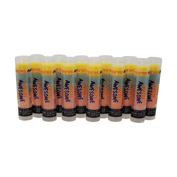 You're Awesome Lip Balm - 12 Pack: The Ultimate Gift to Show Some Sass

Get ready to wow your friends with our You're Awesome lip balm, now available in a fabulous 12-pack that's all about spreading sass and flavor. Each balm features our iconic three-layered design, serving up a burst of deliciousness that screams "You're awesome!"

Flavor Journey:

Yellow Layer: Dive into the sweet sensation of Cherry.
Blue Layer: Savor the cool rush of Strawberry.
Orange Layer: Indulge in the tropical tang of Mango.

Each layer brings its own sass to the table, making lip care as fun as it is essential.

Product Highlights:

Long-Lasting Hydration: Packed with Castor Seed Oil and Olive Fruit Oil to keep lips moisturized all day.
Natural Ingredients: Crafted with Beeswax and Carnauba Wax for lip-loving goodness without any nasty stuff.
Satin Finish: Perfectly blends matte and gloss for a flawless, lasting look.
Pack Type: Easy-peasy multi-pack for sharing the sass and showing off your lip game.
Skin Type: Works like a charm on all skin types, even the sensitive souls.

Why You'll Love It:

This 12-pack of lip balms is proudly made in the USA, starring natural ingredients like Beeswax, Olive Fruit Oil, and Castor Seed Oil. No alcohol or aerosol means it's safe for sensitive skin and acne-prone pouts. With a shelf life of 12 months, these lip balms keep the sass going strong.

Eco-Friendly and Safe:

Cruelty-Free & Chemical-Free: Say no to harsh chemicals like Formaldehyde and Phthalates. Plus, it's cruelty-free, so you can feel good about your sassiness!

This special edition Gettin Lippy lip balm set comes with 12 sticks of pure awesome. Whether you're treating yourself or spreading the love, these lip balms are the ultimate way to show some sass and keep those lips feeling fantastic.

MADE IN THE USA!!