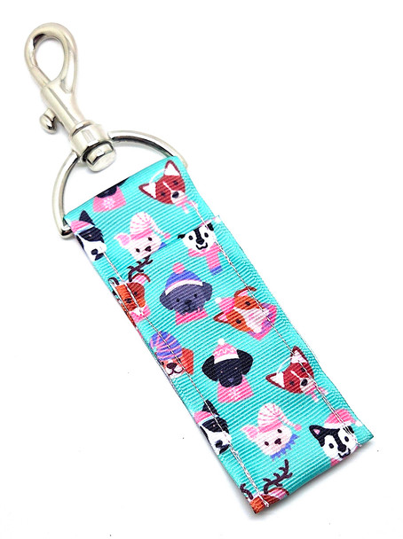 Cold Noses, Cozy Hats – Winter Pup Vibes Lip Balm Holder

Get ready to sleigh your winter style with the Cold Noses, Cozy Hats Lip Balm Holder — the perfect seasonal accessory for dog lovers and anyone who can’t resist a cute holiday vibe!

This festive design features a cheerful green background covered in adorable dogs with stocking hats in fun, playful patterns. Whether it reminds you of bundling up your pup for a frosty walk or just gives you that cozy winter feeling, this lip balm holder is guaranteed to keep your chapstick close, secure, and ready for every chilly day.

Clip it onto your keys, purse, backpack, lanyard, or dog-walking bag so you’re never left with dry lips — even on the coldest mornings.

Why You’ll Love It

Festive Winter Design – Green background with cute stocking hats for that cozy holiday vibe

Perfect for Dog Lovers & Winter Fans – Great for dog moms, pet parents, or anyone who loves the warm + fuzzy aesthetic

Never Lose Your Chapstick Again – Swivel clasp keeps your lip balm secure, upright, and easily accessible

Cute + Durable – High-quality fabric made for everyday use

Product Details

Size: Approx. 6.5" x 1.5"

Material: High-quality printed fabric

Includes: 1 Cold Noses, Cozy Hats lip balm holder (lip balm not included)

Handcrafted in the USA