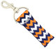 Sideline Swagger – Navy, Orange & White Chevron Lip Balm Holder Keychain

Turn heads on and off the field with Sideline Swagger—a sporty, bold, and stylish lip balm holder perfect for fans, cheerleaders, and spirited students. Featuring a navy blue background with alternating orange and white chevron stripes, this vibrant lippy clip keeps your chapstick handy while showing off your team pride. It's the perfect match for tailgates, pep rallies, or everyday hustle!

Why You’ll Love It:

Team Spirit Ready – Bold school color vibes in a classic chevron pattern
Functional & Fashionable – Easily clips onto your bag, keys, or lanyard
Perfect Gift – Great for athletes, fans, and cheer squads
Durable & Stylish – Made with high-quality printed fabric

Product Details:

Size: Approx. 6.5" x 1.5"

Material: High-quality printed fabric

Includes: 1 Sideline Swagger lip balm holder (lip balm not included)

Handmade with love by Gettin Lippy in the USA