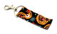Sugar Skulls Pumpkin Lip Balm Holder

Add a touch of spooky glam to your daily essentials with our Sugar Skulls Pumpkin Lip Balm Holder! This bold and festive design features vibrant sugar skull pumpkins on a deep black background—blending Halloween vibes with Dia de los Muertos flair. It's fun, fierce, and a little frightening (in the best way possible).

Clip it to your keys, purse, backpack, or trick-or-treat bag and keep your favorite lip balm handy all spooky season long!

Why You’ll Love It
Bold & Beautiful Design

Celebrate the season with spooky sugar skull pumpkins that are just as stylish as they are haunting. The mix of color and creepy-cute detail makes this lip balm holder a showstopper!

No More Lost Lip Balm

Keep your balm secure and accessible at all times! The built-in swivel clasp lets you clip it anywhere—no more digging through bags or pockets.

Handmade in the USA

Lovingly handmade with premium materials and care. Built for durability, this holder won’t quit—even after the last candy corn is gone.

Perfect For:

Halloween party favors & stocking stuffers

Dia de los Muertos celebrations

Teachers, coworkers, teens, and friends

Those who love unique seasonal accessories

Fans of spooky, cute, and creative fall gear

Buy With Confidence

Our Gettin’ Lippy holders are top-rated for quality and design, and we back every order with a 100% Money-Back Guarantee. If you’re not completely obsessed, we’ll refund you—no tricks, just treats.

Product Details:

Dimensions: 6.5 inches (with hook) x 1.5 inches

Includes: 1 Sugar Skulls Pumpkin Lip Balm Holder

Note: Lip balm not included. Pair it with one of our fall 3-layered flavored lip balms for a complete seasonal vibe.

Handmade in the USA – Grab Yours Before They Disappear!