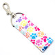 Color Me Paw-some – Rainbow Paw Print Lip Balm Holder Keychain

Bright, bold, and bursting with personality — the Color Me Paw-some Lip Balm Holder is the perfect accessory for pet lovers, school spirit supporters, and anyone who loves a splash of color! Featuring a crisp white background covered in playful paw prints in pink, blue, purple, orange, yellow, grey, red, and green, this adorable keychain screams fun and paw-sitivity.

Whether you’re cheering for a team, rocking school colors, or proudly embracing your inner dog or cat parent, this vibrant lip balm holder keeps your chapstick or lip balm handy while adding a pop of cheerful style to your everyday routine.

Why You’ll Love It

Rainbow Paw Prints – A lively mix of bright, multi-colored paws for maximum cuteness

Pet Lover Perfect – Ideal for dog moms, cat dads, and animal-obsessed humans

Spirit Ready – Great for school colors, team pride, or matching your favorite outfit

Carry-Anywhere Convenience – Clip it to your keys, purse, lanyard, or backpack

Product Details

Size: Approx. 6.5" x 1.5"

Material: High-quality printed fabric

Includes: 1 rainbow paw print lip balm holder (lip balm not included)

Handcrafted in the USA