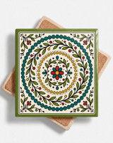 Emerald green bordered folk mandala ceramic coaster with teal, red and gold pattern2