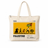 Cream canvas zip tote bag with editorial-style 1948 Palestine graphic print showing a family walking with a Palestinian flag and olive tree, text reading Our Land Our Story Our Future