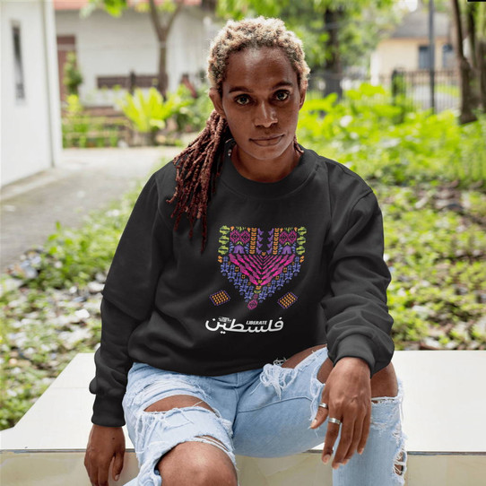 The TPFF 2024 Liberate Palestine Unisex Crewneck Sweatshirt is a must-have for those passionate about spreading awareness and supporting the cause of Palestine liberation. Made from high-quality materials, this sweatshirt is comfortable, durable, and stylish. The bold graphic design on the front makes a powerful statement, while the ribbed cuffs and waistband provide a snug fit. Available in sizes XS to 3XL, this sweatshirt is suitable for all body types. Show your solidarity and stand out in style with the TPFF 2024 Liberate Palestine sweatshirt