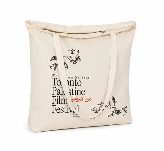 Natural canvas tote bag with Toronto Palestine Film Festival wordmark, hand-drawn eye and vine motif, zippered top closure and double handles, back view