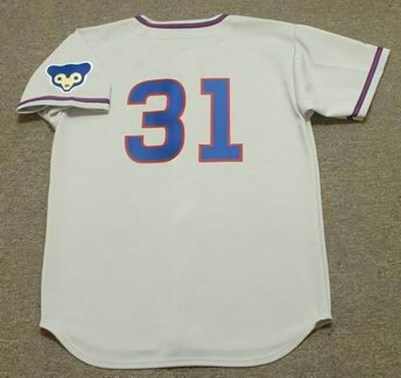 Atlanta Braves away or road jersey worn by Hank Aaron during the 1968  or 1969 MLB season. Jersey is grey in color with blue and red stitched type  on front and back.