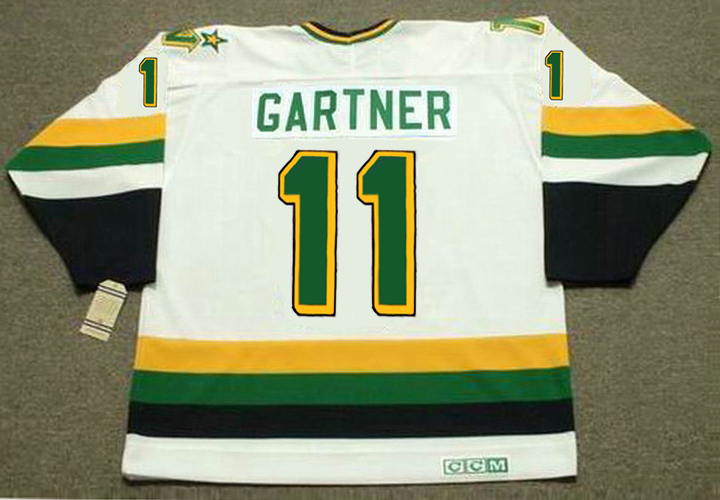 Mike Gartner's jersey No. 11 is raised to the roof during a