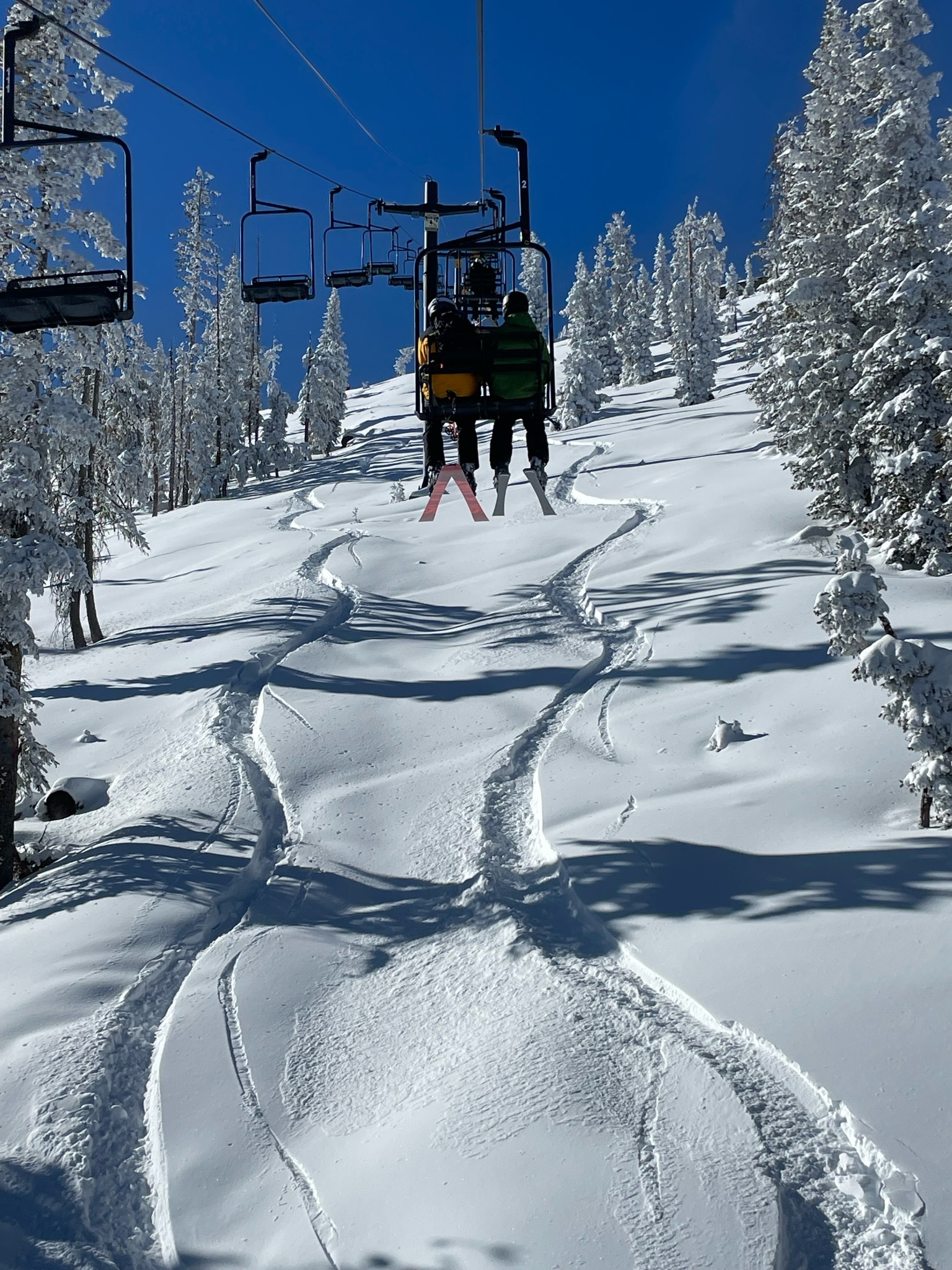 Chairlift over fresh snow at a ski area