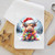 Close-up of Highland cow Christmas dish towel — Santa hat, colorful light strands and snow globe effect sublimated on white waffle weave
