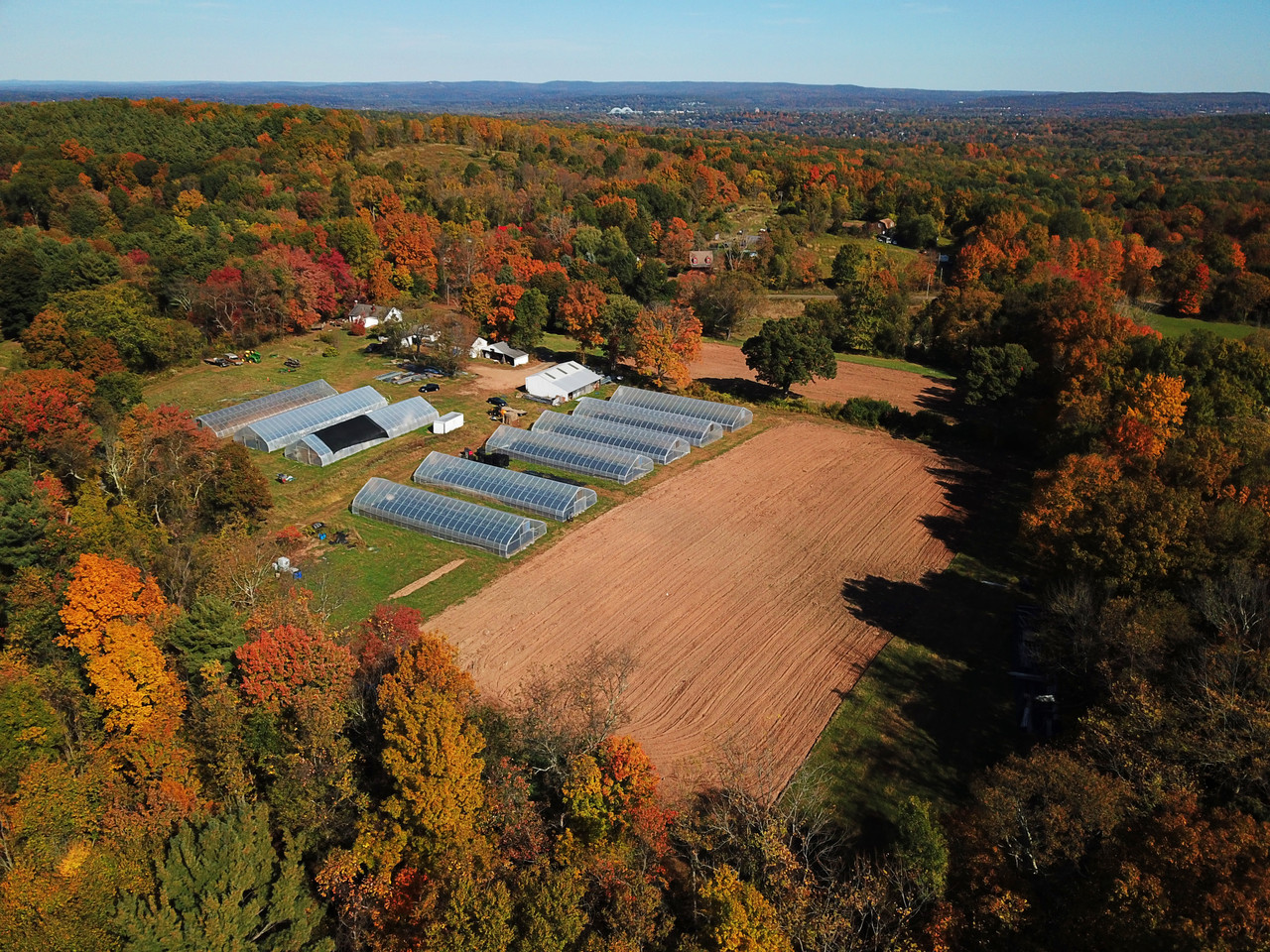NRCS high tunnel aerial drone view showing full footprint on a customer farm