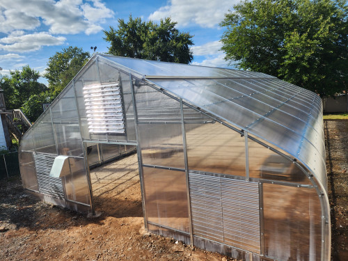 Aluminum Base and Cap to Secure Polycarbonate sheet over curved roof profiles.