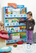 Girl standing with Blue Tidy Books Bookcase