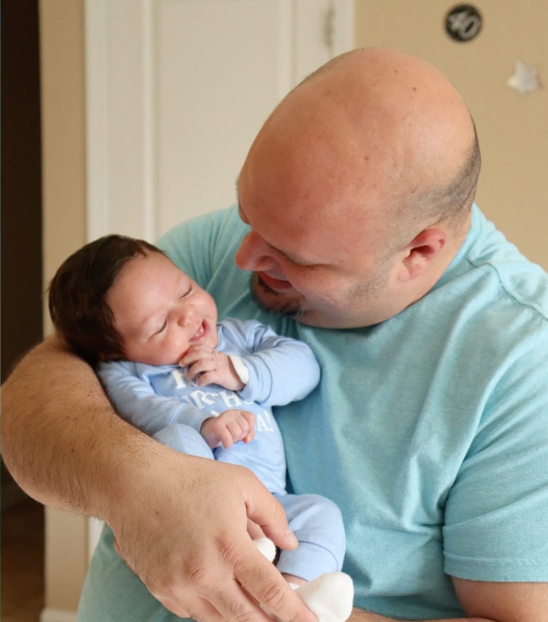 Father holding daughter