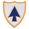 Shield-shaped 26th Infantry Regiment Blue Spaders patch with a gold border and scalloped top, showing a blue upward-pointing Mohawk arrowhead outlined in gold on a white field.