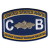 Barrel-shaped Navy rating-style patch with gold bands reading United States Navy and Seabee Combat Warfare Enlisted, white letters C and B flanking the silver SCW device on navy blue with a merrowed border.